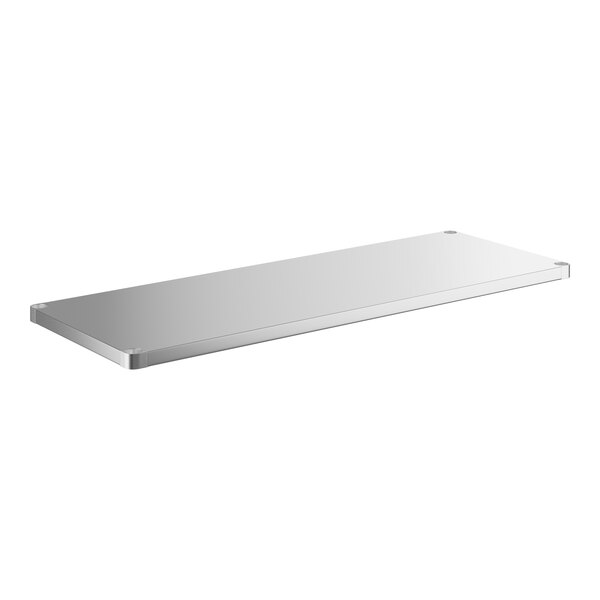 A stainless steel undershelf for a rectangular work table with a backsplash.