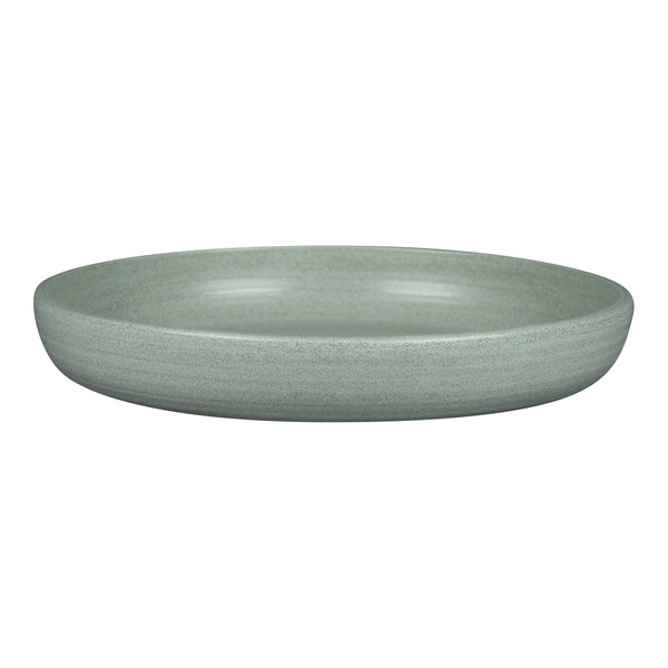 Aqua green porcelain deep coupe plate with a white rim on a white surface.