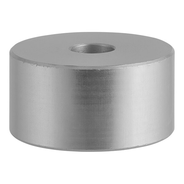 A silver cylinder with a hole.