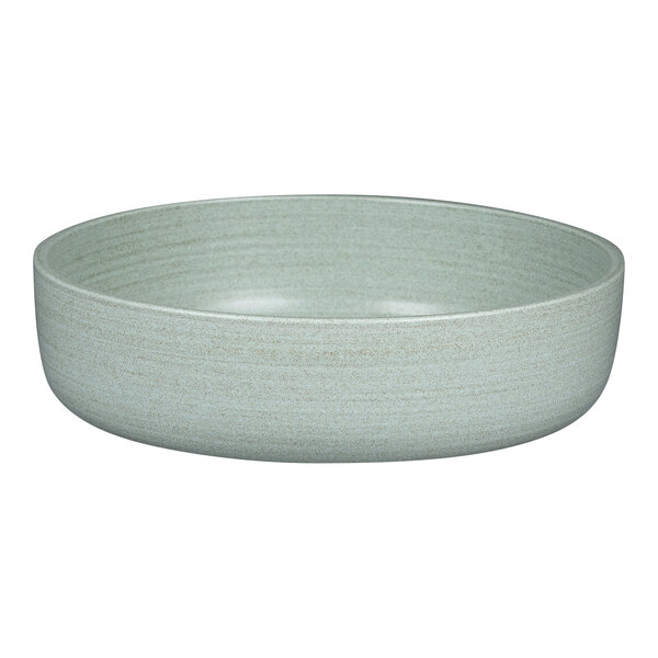 A close-up of a Rak Porcelain aqua green bowl with a light gray rim.