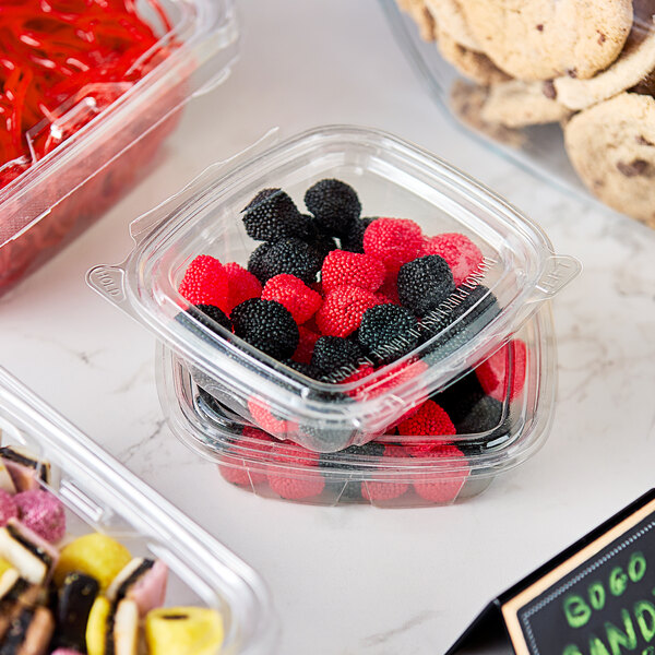 A plastic container of Gustaf's red and black berries licorice.