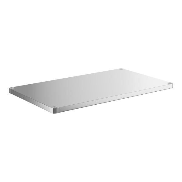 A stainless steel rectangular undershelf for a work table.