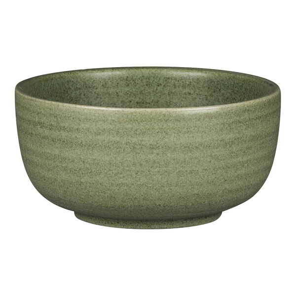 A close-up of a dark green Rakstone Selva porcelain bowl with a white rim.