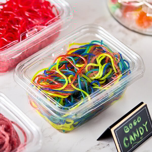 A plastic container of Gustaf's Rainbow Licorice Laces.