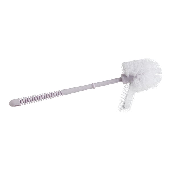 A white plastic toilet brush with a white handle.
