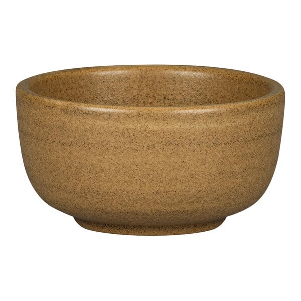 A brown RAK Porcelain ramekin with a handle.