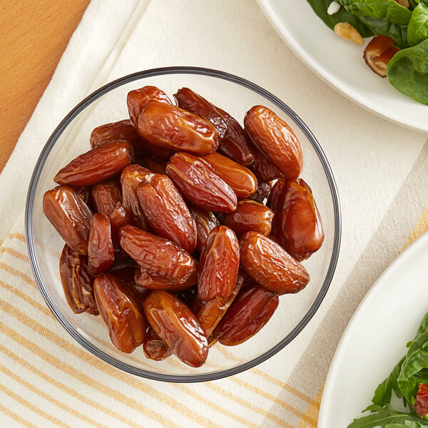 A bowl of Dried Pitted Deglet Noor Dates on a table.