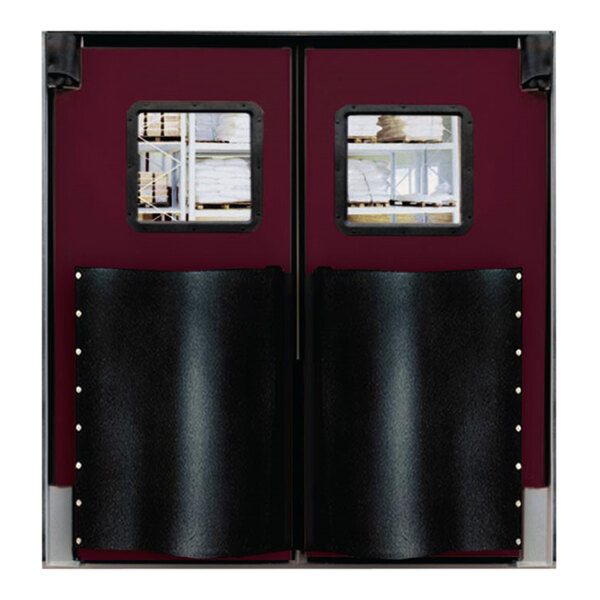 A pair of double swinging traffic doors with red trim and windows.