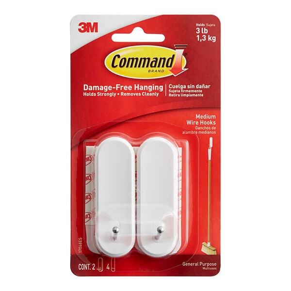 A package of two white 3M Command wire hooks.