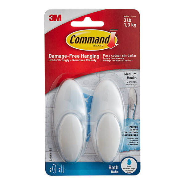 A package of white 3M Command bath hooks.