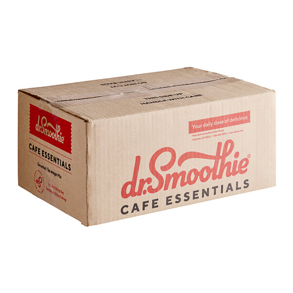 A brown cardboard box of Dr. Smoothie Cafe Essentials Vanilla Cream Beverage Mix with red text on a counter.