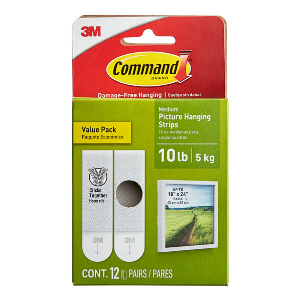 A package of 12 white 3M Command medium picture hanging strip pairs.