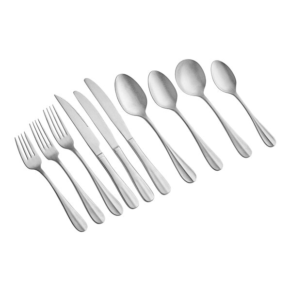 A close-up of Acopa Josette stainless steel dinner/dessert spoons.