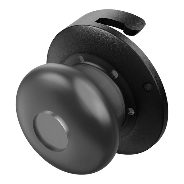 A black Motorola silicone ear tip on a round black object.