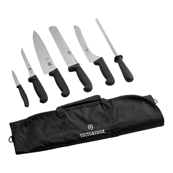 A Victorinox 7-piece knife set in a black case with white text.