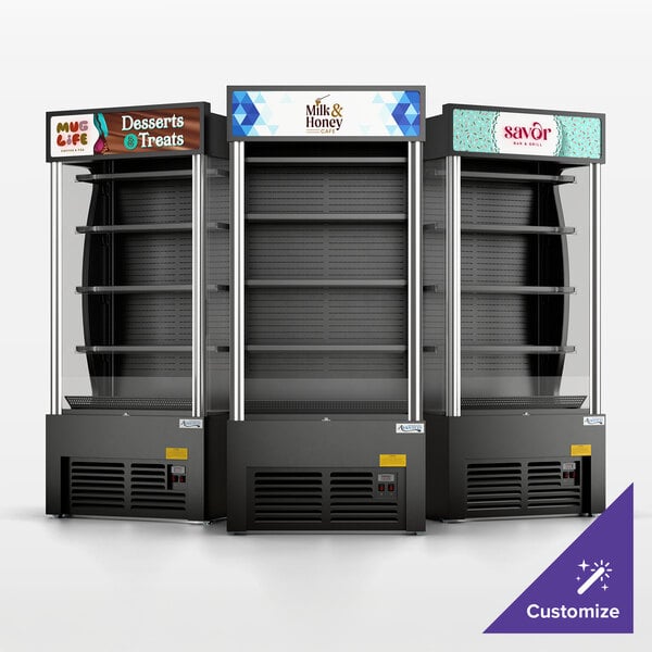 A set of three black refrigerated air curtain merchandisers with customizable signage at the top.