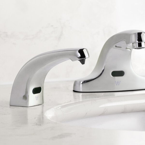 A Waterloo chrome soap dispenser on a white counter.