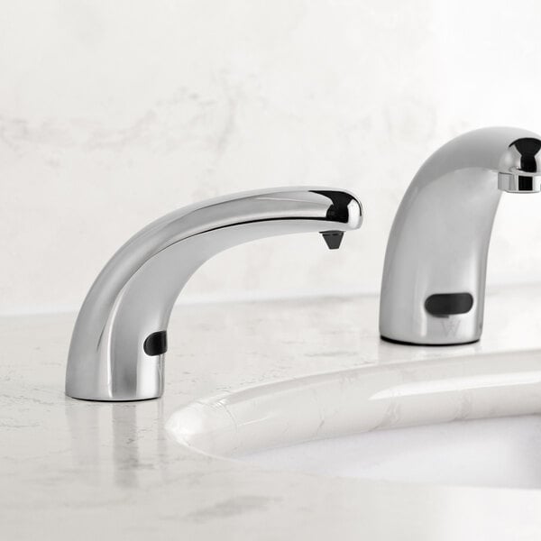 A Waterloo chrome soap dispenser with a foam spout on a white counter.