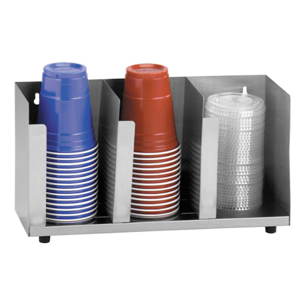 A metal Dispense-Rite countertop cup and lid holder with several cups.