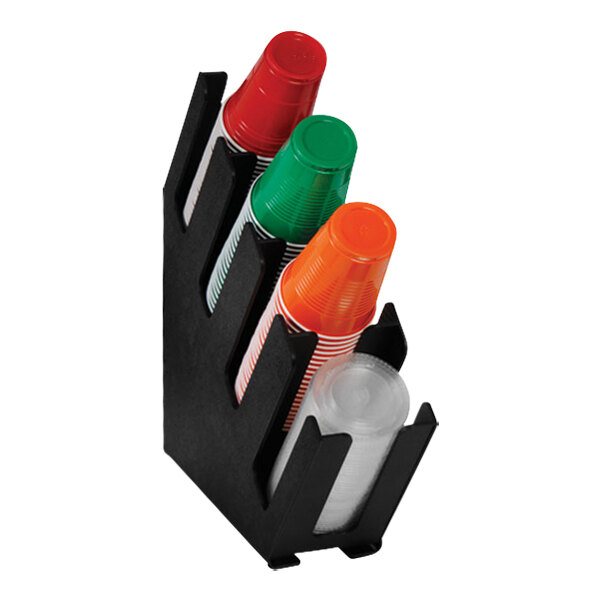 A black Dispense-Rite countertop cup and lid holder with plastic cups in it.