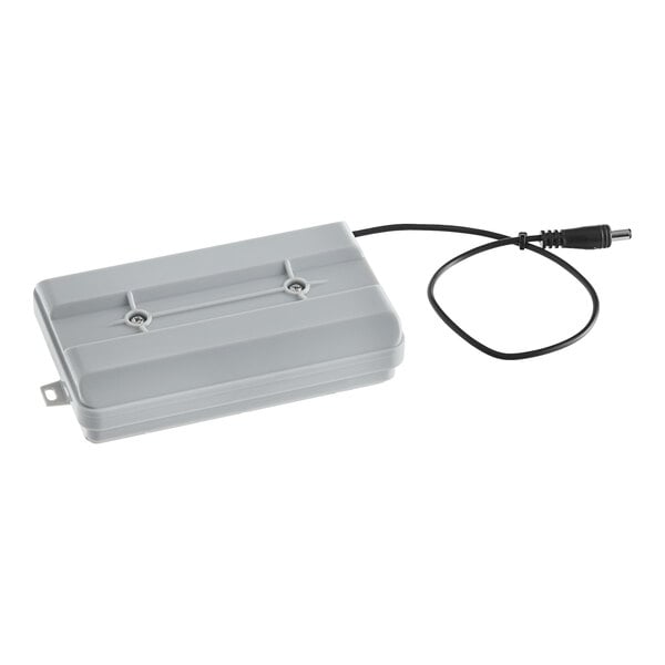 A grey rectangular Waterloo dispenser control box with a black cord.