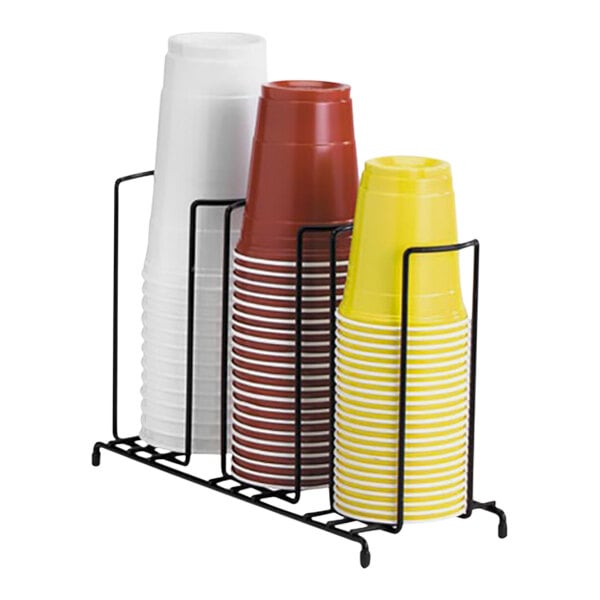 A black wire rack holding three stacks of cups.