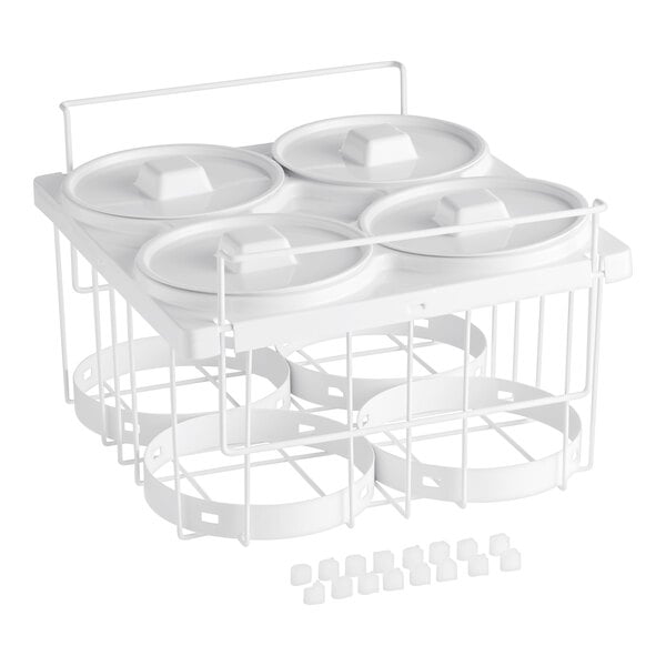 A white plastic dish rack with four white containers and lids.