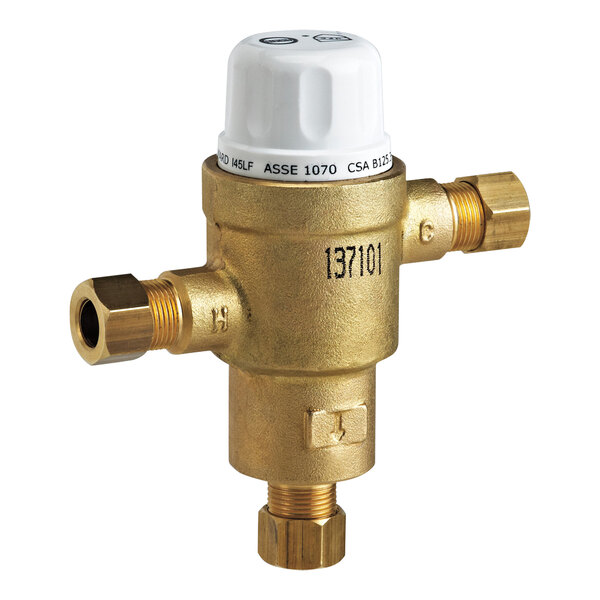 A close-up of a brass Delta Faucet thermostatic mixing valve.