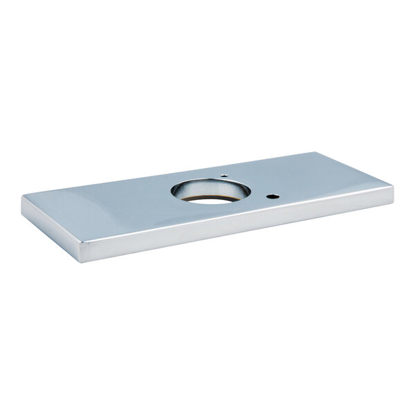 A chrome rectangular Delta faucet deck plate with a hole in the center.