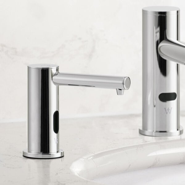 A Waterloo chrome automatic soap dispenser.