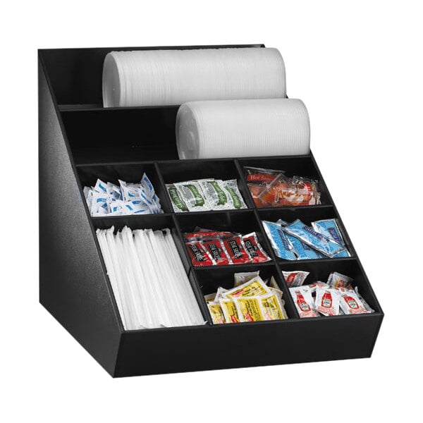 A black Dispense-Rite countertop organizer with a variety of condiments.