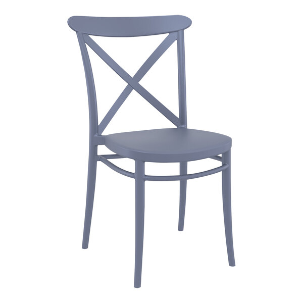 A dark gray Siesta Cross resin dining chair with a cross back.