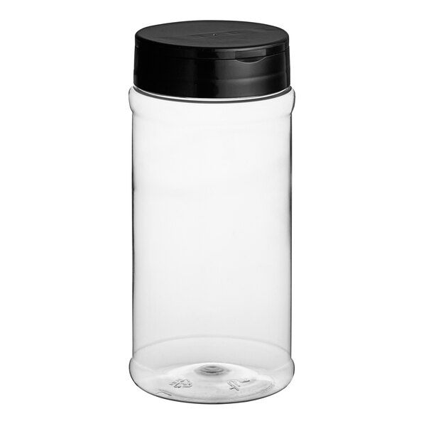 A clear plastic round spice container with a black lid.