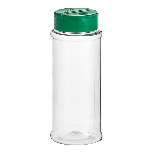 A clear plastic container with a green lid.