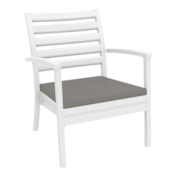 A Siesta Artemis XL white outdoor club arm chair with a taupe cushion.