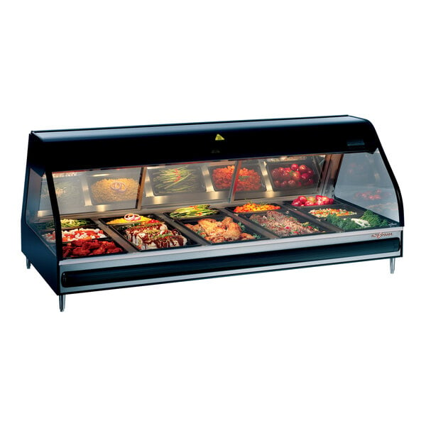 A black Alto-Shaam countertop heated display case with food on a counter.