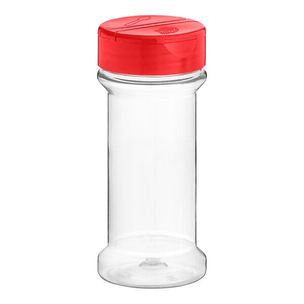 A clear plastic container with a red lid.