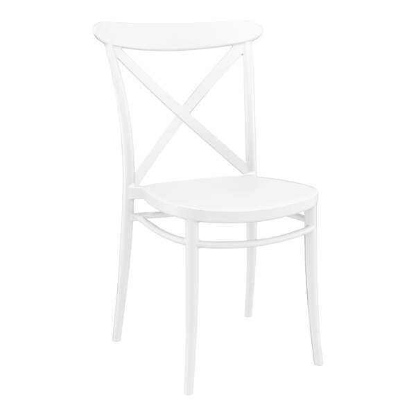 A Siesta Cross white resin outdoor dining chair with a cross back and seat.