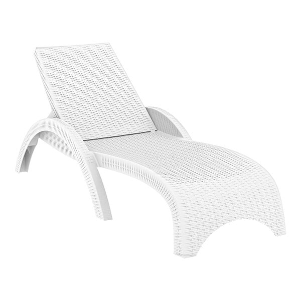 A Siesta Miami white wicker chaise lounge with a white cushion on it.
