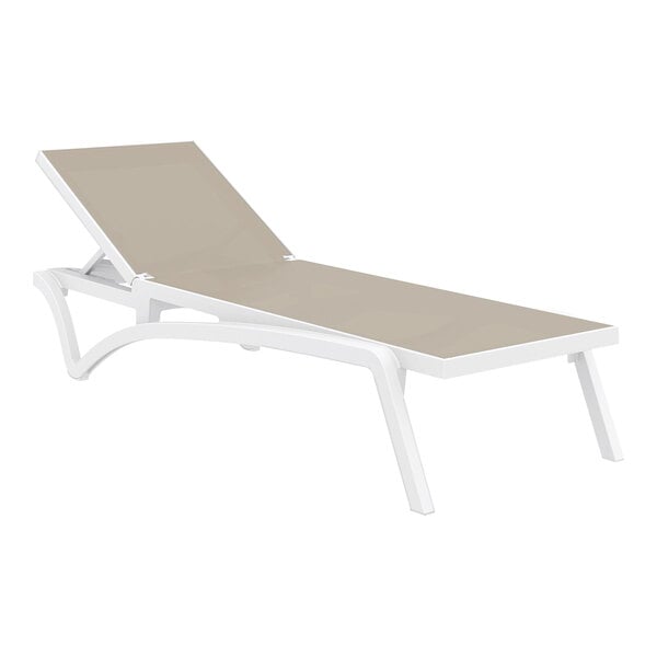 A Siesta Pacific white resin outdoor chaise lounge with a taupe sling on a white background.