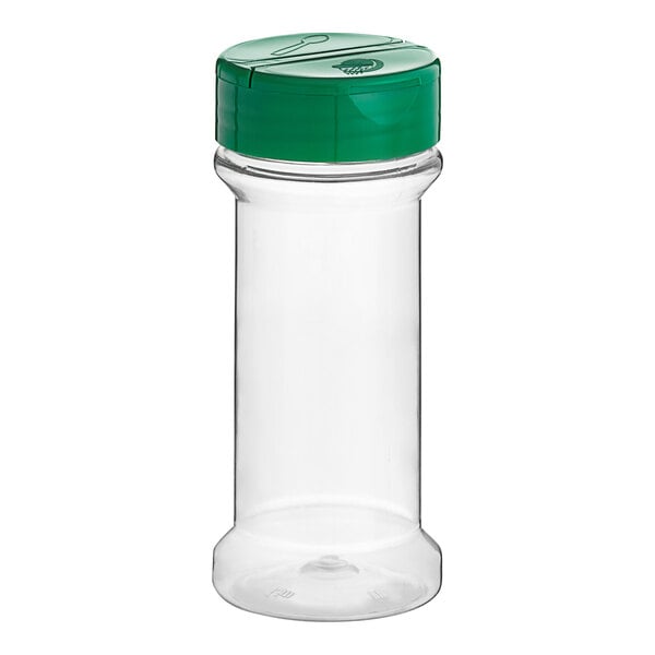 A clear plastic container with a green lid.