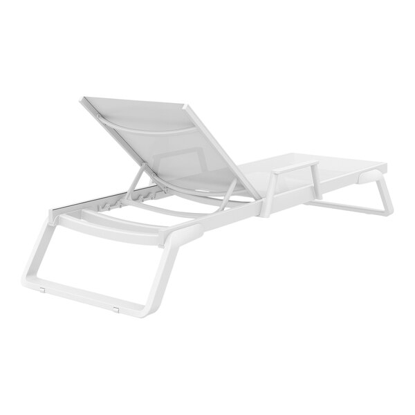 A Siesta Tropic white resin outdoor arm chaise lounge with white sling on a white background.