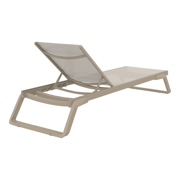 A taupe Siesta Tropic chaise lounge with a taupe sling.