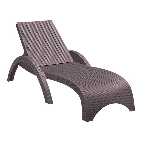 A Siesta Miami brown wickerlook resin outdoor chaise lounge chair.
