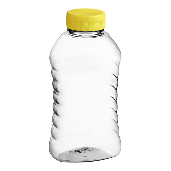 A clear plastic Ribbed Hourglass honey bottle with a yellow flip top lid.