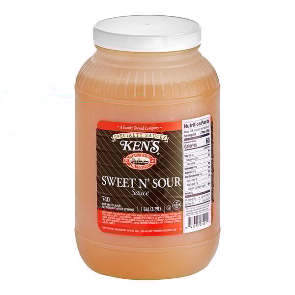 A plastic container of Ken's Foods sweet and sour sauce.