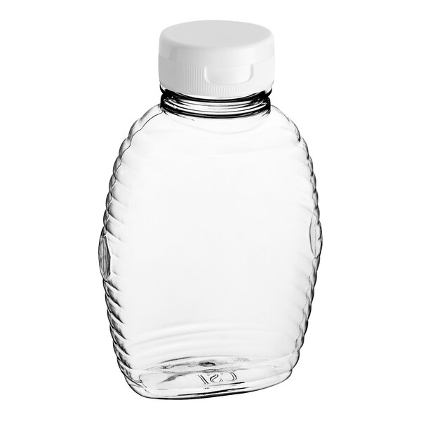 A clear Queenline PET honey bottle with a white plastic flip top lid.