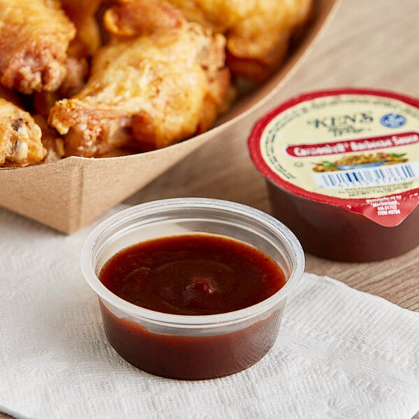 An open container of Ken's Foods Cannonball BBQ Sauce.