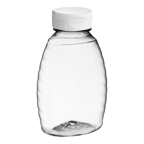 A Classic Queenline PET honey bottle with a white plastic flip top lid.