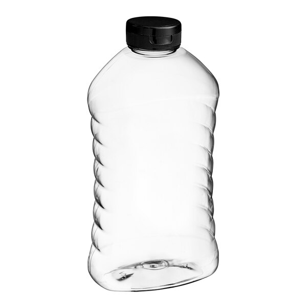 A clear plastic ribbed hourglass honey bottle with a black plastic flip top lid.